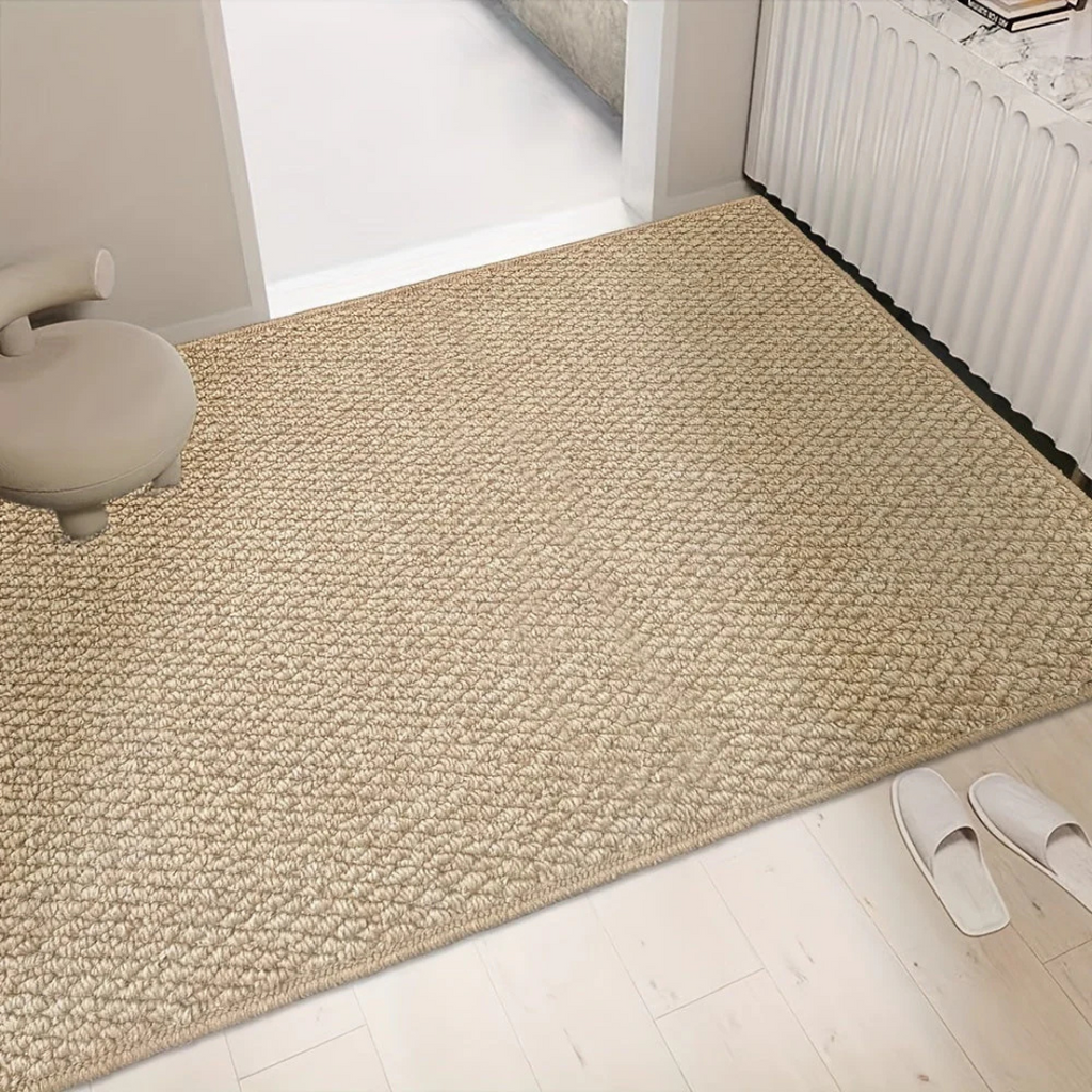 Large woven mat on a light wood entryway floor