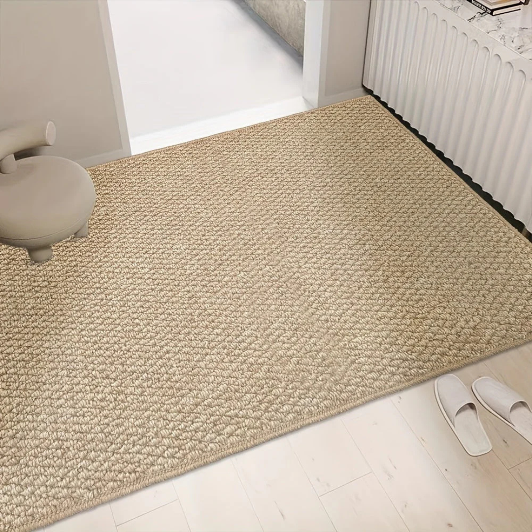Large woven mat on a light wood entryway floor