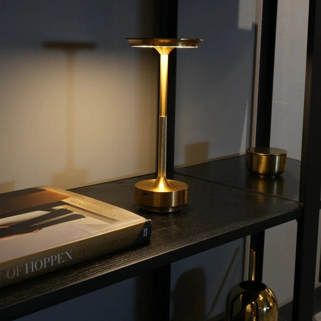 Touch table lamp shown in a calm, dimly lit room