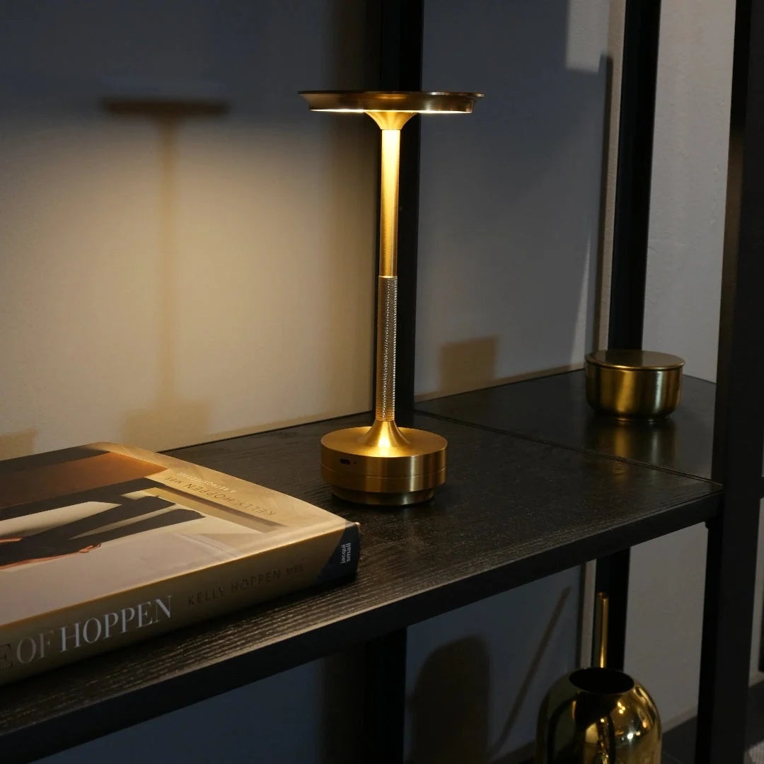 Touch table lamp shown in a calm, dimly lit room